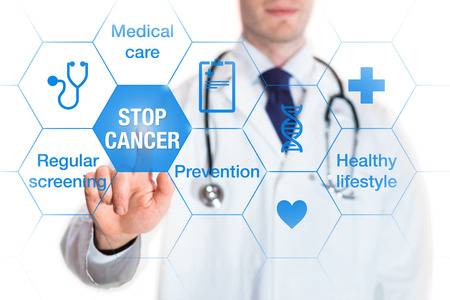 70617703 cancer prevention and awareness concept with icons and words on screen and medical doctor touching a