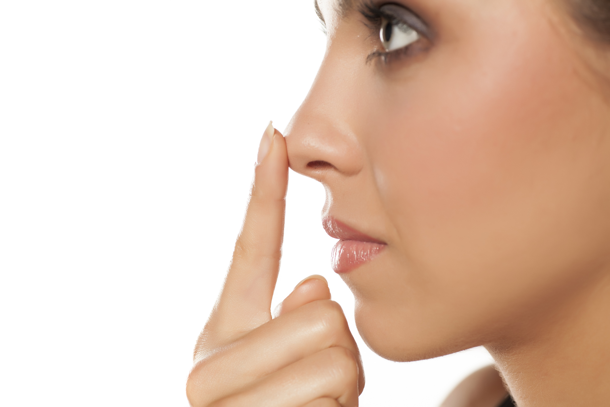 profile-of-young-woman-touching-her-nose